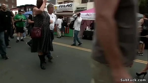 Blonde is pissed in street fair outdoor