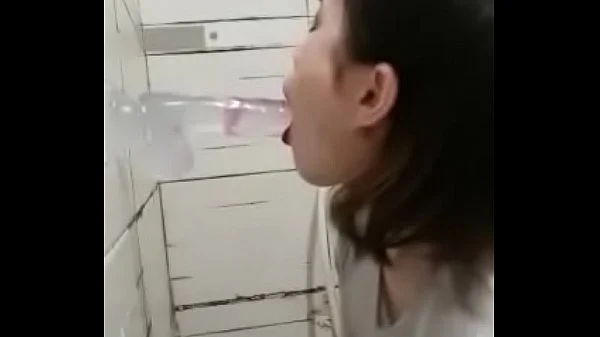Asian deepthroating a dildo
